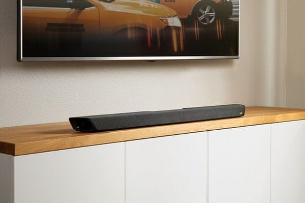 moderný elegantný soudbar so subwooferom polk audio magnifi 2 výkon 200 w Bluetooth chromecast wifi pripojenie voice adjust pre čisté dialógy hdmi s arc optický diaľkový ovládač google assistant hlasové ovládanie priestorový 5.1 zvuk dolby digital sda dts inštalácia aj na stenu miestnosti 4k hd televízory režimy film hudba šport nočný režim nízky profil bezdrôtový subwoofer