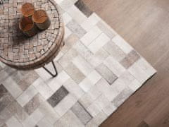 Beliani Šedo-béžový kožený koberec 140x200 cm KORFEZ