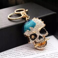 Pinets® Přívěsek na klíče zlatá lebka s modrou skvrnou a kubickou zirkonií