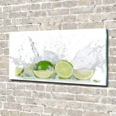 Wallmuralia Foto obraz skleněný horizontální Limetky a voda 100x50 cm 4 úchytky