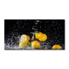 Wallmuralia Foto obraz skleněný horizontální Citrony a voda 120x60 cm 2 úchytky
