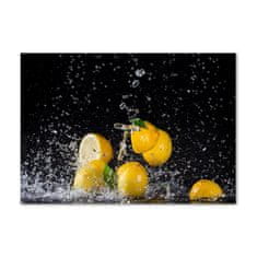 Wallmuralia Foto obraz skleněný horizontální Citrony a voda 100x70 cm 4 úchytky