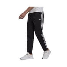 Adidas Kalhoty na trenínk černé 170 - 175 cm/M Primegreen Essentials Warmup Tapered 3STRIPES