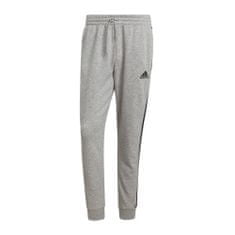 Adidas Kalhoty na trenínk šedé 164 - 169 cm/S Essentials Fleece Tapered Cuff 3STRIPES