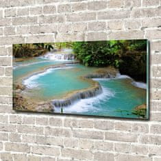 Wallmuralia Foto obraz skleněný horizontální Vodopád v lese 100x50 cm 2 úchytky