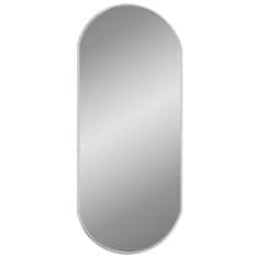 Vidaxl Nástěnné zrcadlo stříbrné 70x30 cm oválné