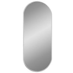 Vidaxl Nástěnné zrcadlo stříbrné 60x25 cm oválné